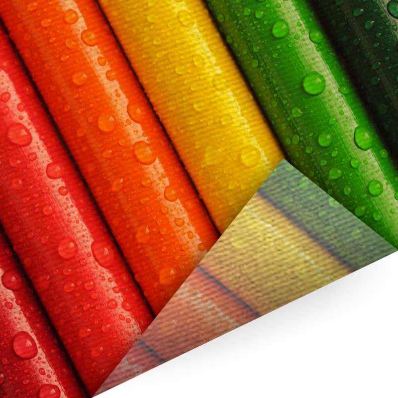 Banen decotex in rood, oranje, geel en groen met een omgeslagen hoek